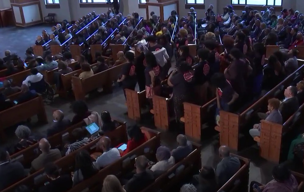 Pro-Palestinian students protest Warnock during a church sermon